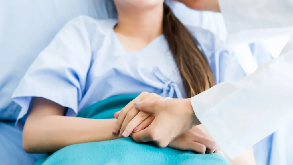 Doctor discussing care with positive emotions to Asian youth