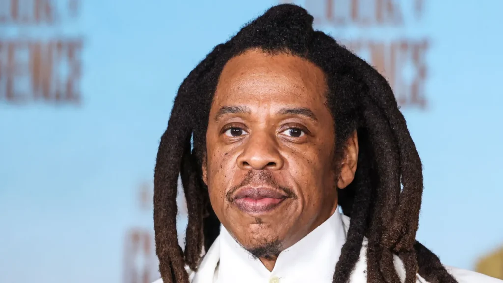 Jay-Z posing for the camera at an event.