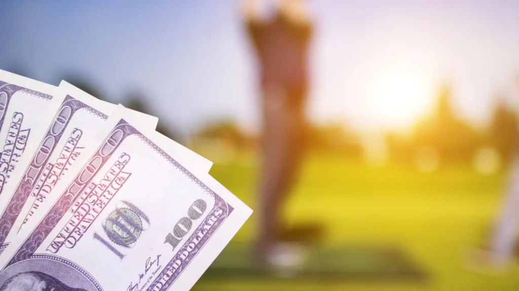 U.S. dollars with golfers in the background