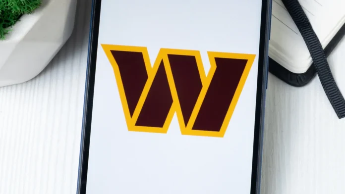 Washington Commanders logo display in a mobile phone screen.
