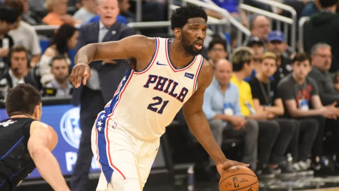 Joel Embiid orlando magic host the philadelphia 76ers at the amway arena Joel Embiid running with a ball.