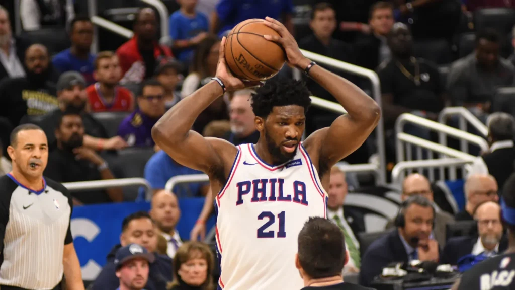 Joel Embiid throwing the ball.