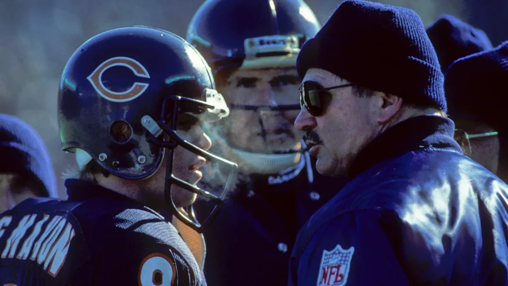 quarterback jim mcmahon and coach mike ditka on the sidelines