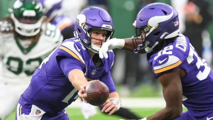 Sam Darnold in action while wearing his former Minnesota Vikings uniform