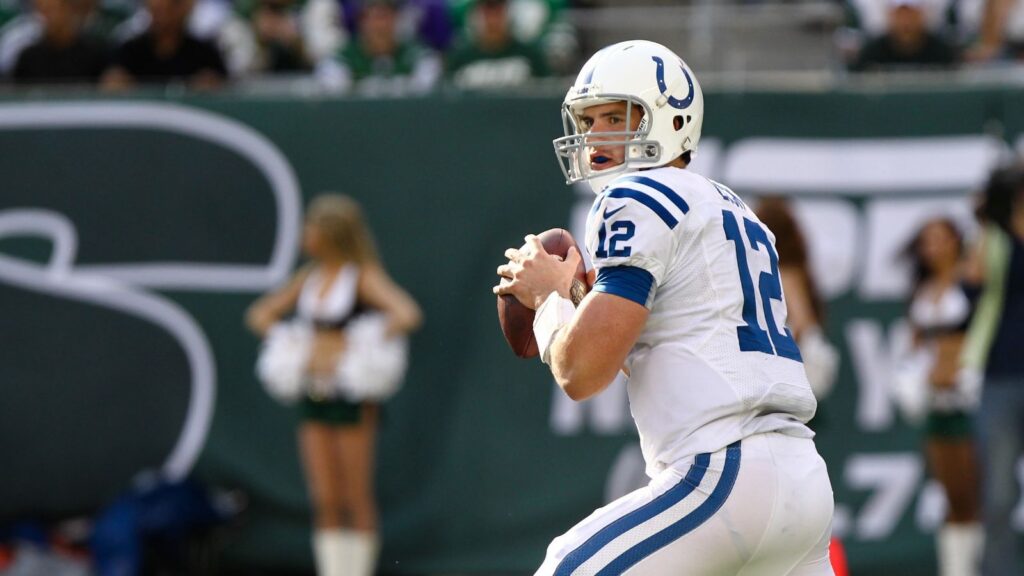 Former Indianapolis Colts quarterback Andrew Luck (12) looks to pass the ball during a match.