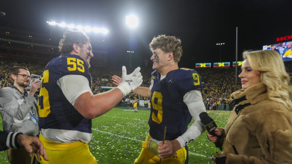 Michigan quarterback J.J. McCarthy #9 celebrates with Michigan defensive line Mason Graham #55 after defeating Alabama during the 2024 Rose Bowl game Monday.