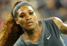 Serena Williams in action during a tennis match.