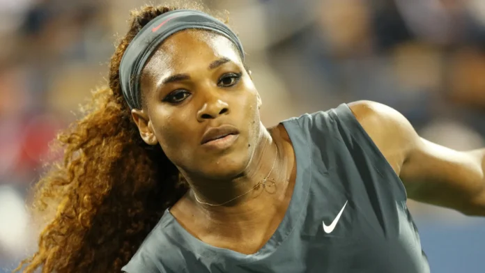 Serena Williams in action during a tennis match.