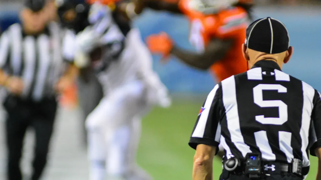 NFL referee judging the players action.